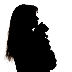 silhouette of a girl with a kitten in hands on a white isolated background, profile of a woman's face and a pet