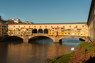 Fototapeta na wymiar Bridge Ponte Vecchio in Florence on a sunny day in autumn