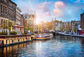 Channel in Amsterdam Netherlands houses river Amstel landmark - obrazy, fototapety, plakaty