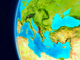 Space view of Albania in red