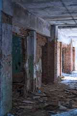 Inside an old abandoned building. The interior of the collapsing building