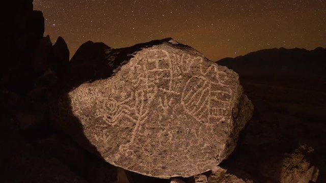 Dolly shot time lapse at night of a sacred Owens Valley Paiute petroglyph site in the Eastern Sierras, California