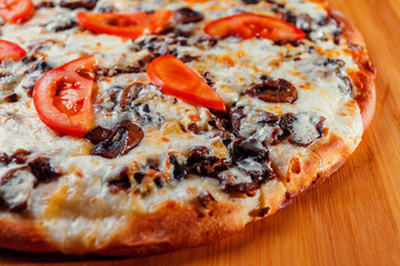 pizza on wooden background