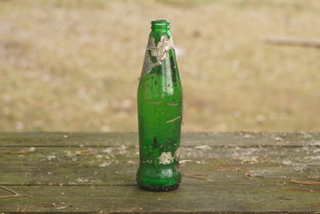 empty old dirty bottle on the table