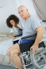 woman fixing an old handicapped bedding