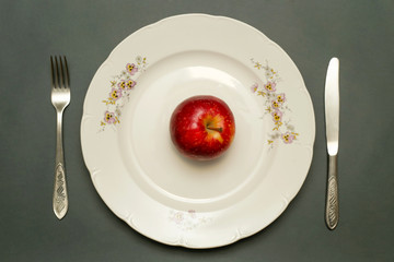 Close up image of red apple on the plate