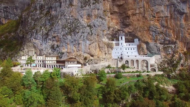 Beautiful rising aerial of the Ostrog monastery in Montenegro.