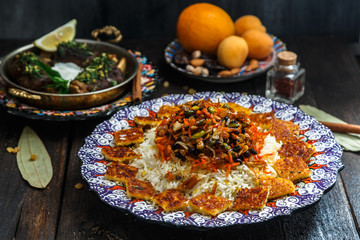 Iranian sweet rice with orange zest, nuts and dried fruits, shirin polo