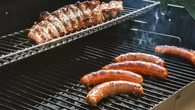 Sausages cooking on barbecue grill for summer outdoor party. Food background, 4K, Ultra High Definition, Ultra HD, UHD, 2160P, 3840 x 2160