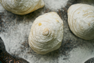 Novruz tray with Azerbaijan traditional pastry cookie Badambura on wooden rustic table background. Dessert for the Azerbaijani national holiday Novruz Bayram