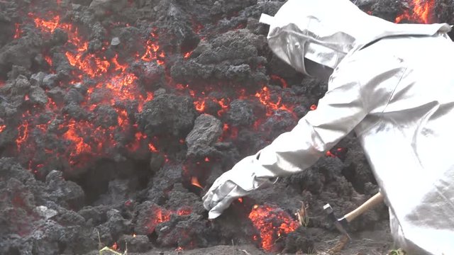 A man in a Lava flows from the Cabo Verde volcano erupts on Cape Verde Island off the coast of Africa.