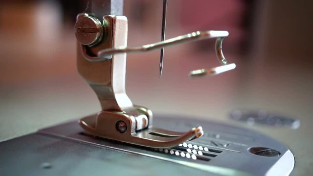 A Needle Of An Industrial Sewing Machine. Slow Motion.