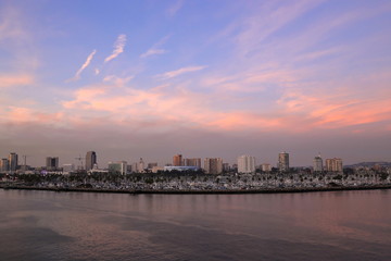 Fototapeta premium A view of Long Beach marina, California from a cruise ship during a twilight