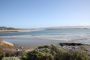 Fototapeta na wymiar Morro Bay shoreline with blue waters