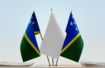 Two flags of Solomon Islands with a white flag in the middle