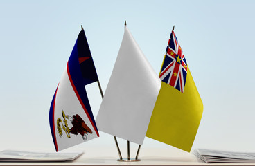 Flags of American Samoa and Niue with a white flag in the middle