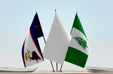 Flags of American Samoa and Norfolk Island with a white flag in the middle