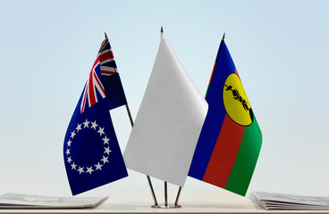 Flags of Cook Islands and New Caledonia with a white flag in the middle