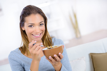 young woman having breakfast at home