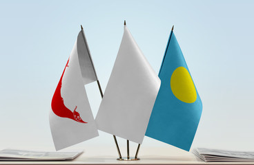 Flags of Easter Island and Palau with a white flag in the middle