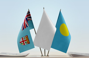 Flags of Fiji and Palau with a white flag in the middle