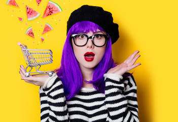 woman with purple hair and shopping cart