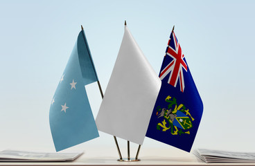 Flags of Federated States of Micronesia and Pitcairn Islands with a white flag in the middle