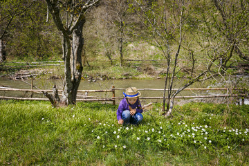 Little girl in a spring forest