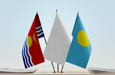 Flags of Kiribati and Palau with a white flag in the middle