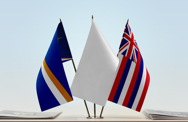 Flags of Marshall Islands and Hawaii with a white flag in the middle