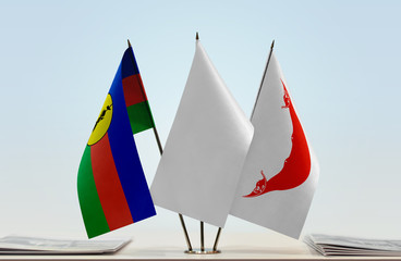 Flags of New Caledonia and Easter Island with a white flag in the middle