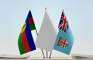 Flags of New Caledonia and Fiji with a white flag in the middle