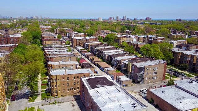 Beautiful aerial around a Moorish dome and lower class neighborhoods on the southside of Chicago.