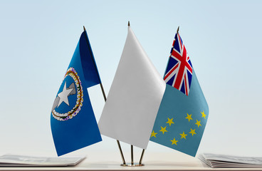 Flags of Northern Mariana Islands and Tuvalu with a white flag in the middle