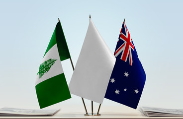 Flags of Norfolk Island and Australia with a white flag in the middle