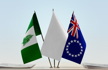 Flags of Norfolk Island and Cook Islands with a white flag in the middle