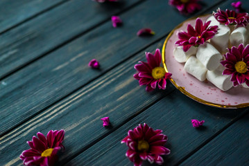 white marshmallow on a pink plate with flowers