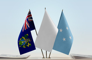 Flags of Pitcairn Islands and Federated States of Micronesia with a white flag in the middle