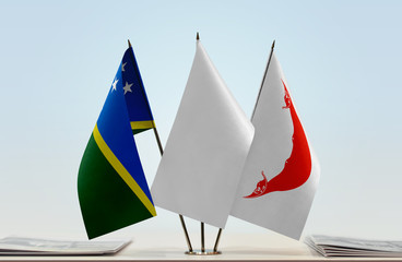Flags of Solomon Islands and Easter Island with a white flag in the middle