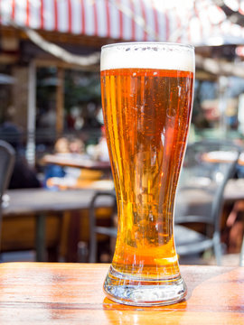 Close up shot of glass of cold beer