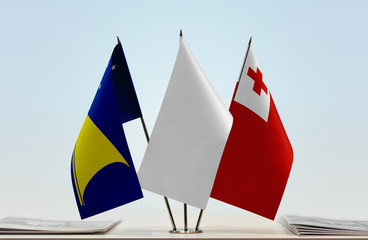 Flags of American Samoa and Tonga with a white flag in the middle