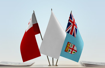 Flags of Tonga and Fiji with a white flag in the middle