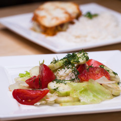 Fresh vegetable salad and bread on a table