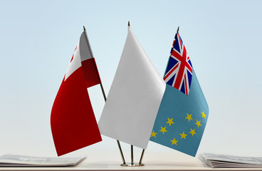 Flags of Tonga and Tuvalu with a white flag in the middle