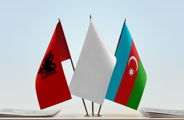 Flags of Albania and Azerbaijan with a white flag in the middle