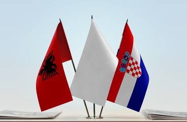 Flags of Albania and Croatia with a white flag in the middle