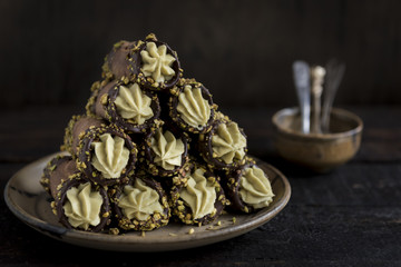 Traditional Italian dessert cannoli with pistachios,selective focus
