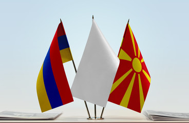 Flags of Armenia and Macedonia with a white flag in the middle