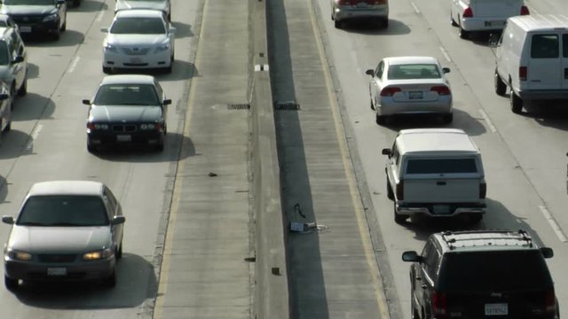 Traffic moves slowly along a busy freeway in Los Angeles.