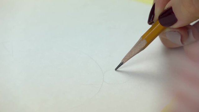 Slow-mo footage. Artist girl hand Begining draws by pencil. Close-up